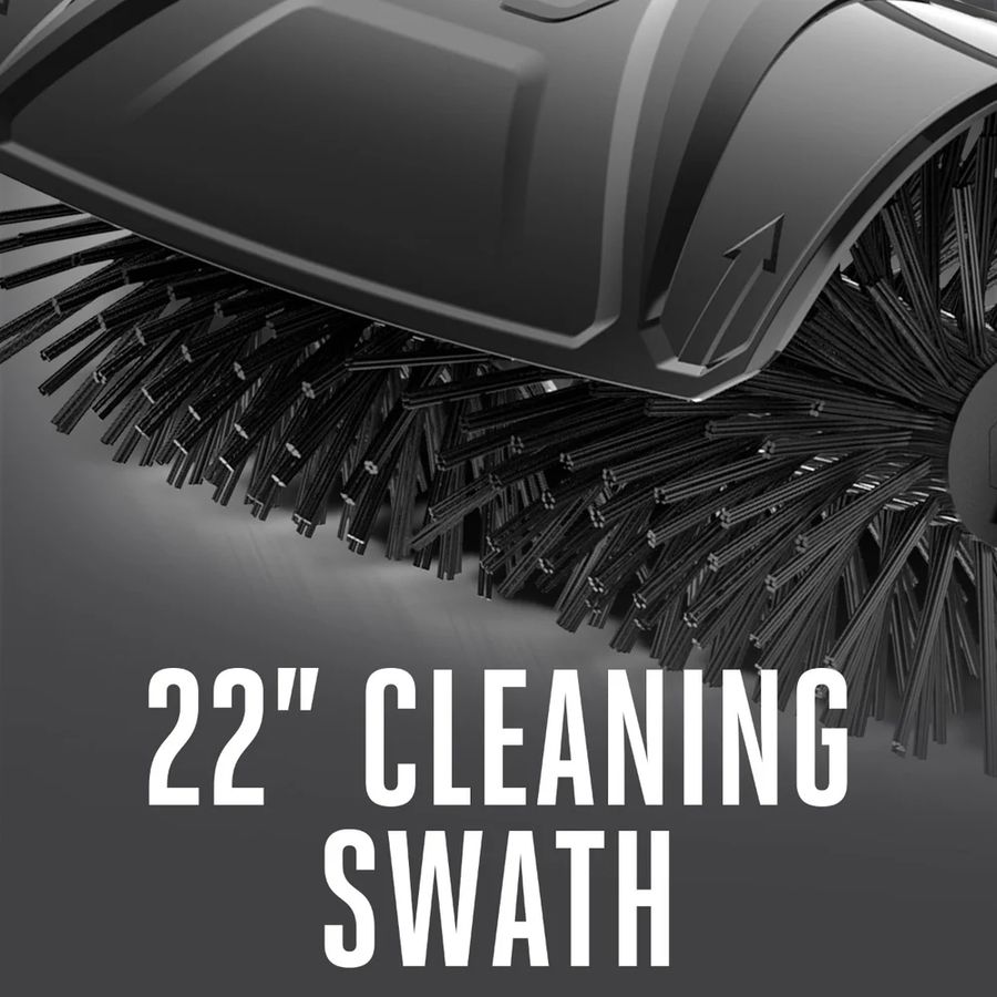 Close-up of the EGO BBA2100 bristle brush attachment showing dense nylon bristles and wide 22-inch cleaning swath beneath the protective debris guard, designed for fast surface clearing.