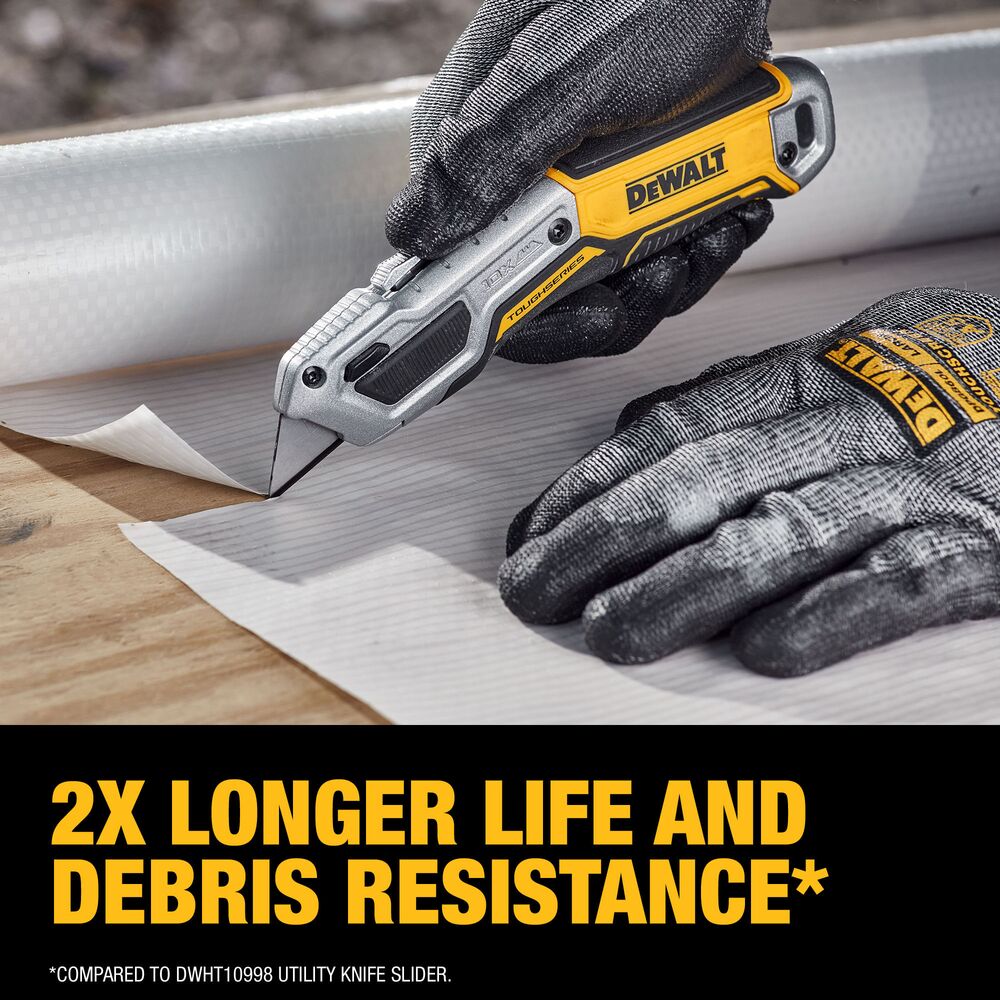 Contractor cutting building wrap with DeWalt DWHT10999 TOUGHSERIES utility knife, showing controlled grip and extended blade during jobsite use.