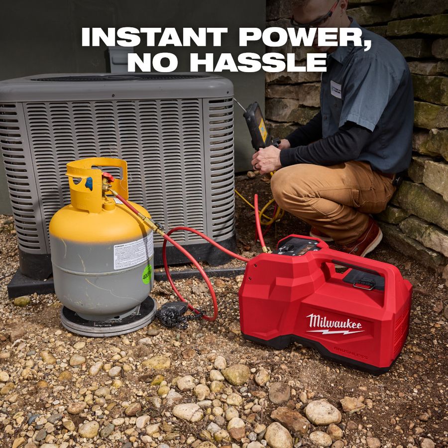 Milwaukee M18 brushless refrigerant recovery machine connected to a refrigerant tank and outdoor HVAC condenser during a cordless service call, with an HVAC technician using digital diagnostic tools while hoses transfer refrigerant for recovery and system servicing.