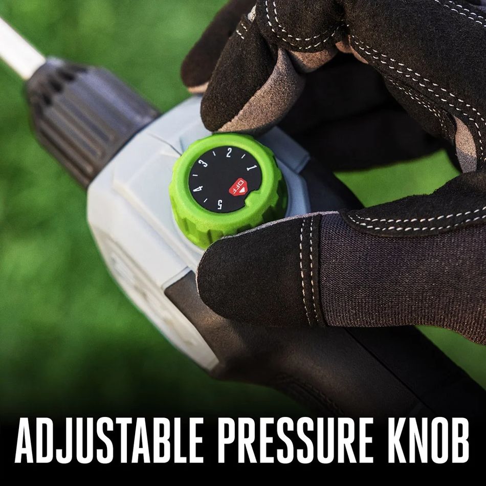 Close-up of gloved hand adjusting the pressure control dial on the EGO 56V backpack sprayer wand, showing numbered settings for spray output control.