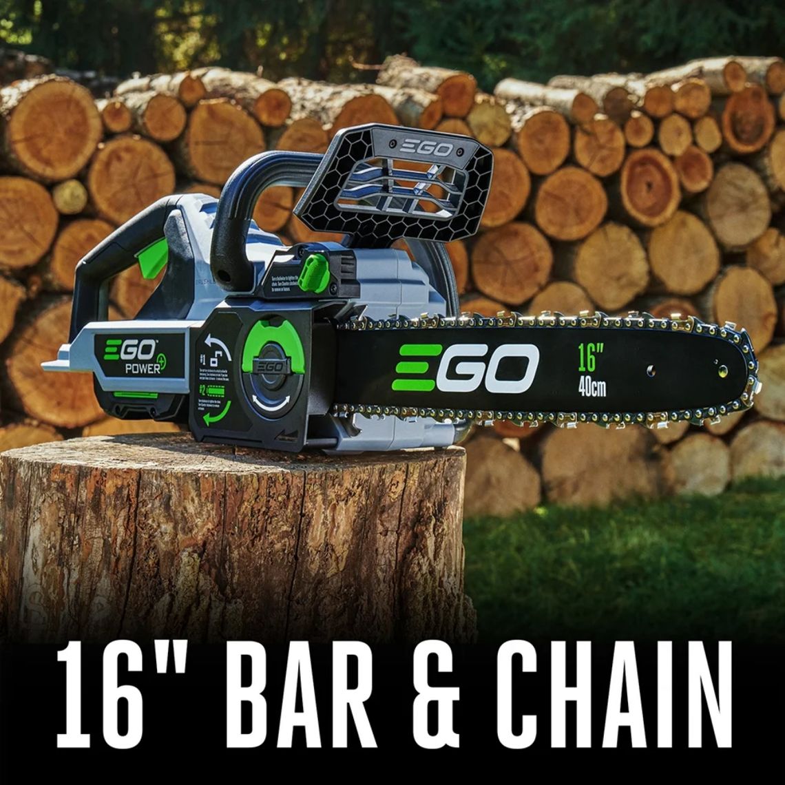 EGO CS1611 56V cordless chainsaw with 16 inch bar and chain resting on tree stump with stacked firewood in background
