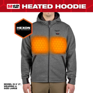 Front view of Milwaukee M12 grey heated hoodie worn by a model, showing illuminated chest heat zones powered by HEXON Heat Technology, full-zip fleece construction, integrated hood, and visible heat control button for cold-weather workwear performance