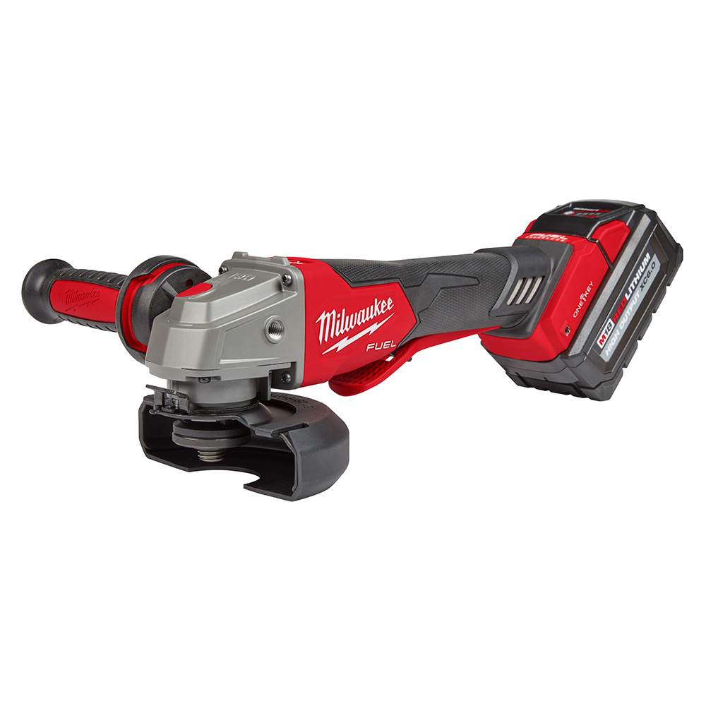 Milwaukee M18 FUEL 4-1/2 inch / 5 inch braking angle grinder with paddle switch, anti-vibration side handle, T27 guard, and M18 REDLITHIUM HIGH OUTPUT XC6.0 battery installed, isolated on white background.
