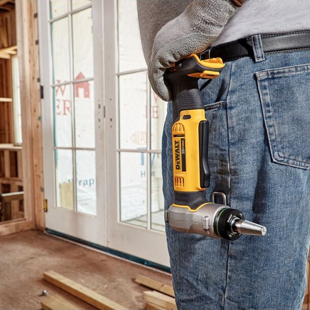 DEWALT DCE400B 20V MAX cordless PEX expander tool clipped to a worker’s belt, shown with right-angle head and expansion mandrel attached.