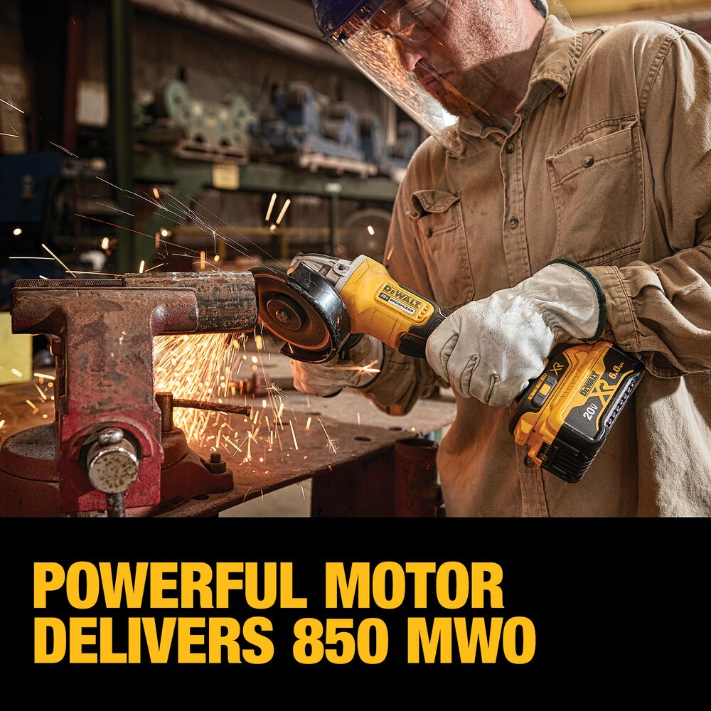 DEWALT 20V MAX XR angle grinder in use cutting metal clamped in a red bench vise, producing sparks, with operator wearing gloves and a clear face shield, and on-image text reading “Powerful motor delivers 850 MWO.”