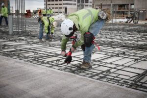 Cut rebar: Workers installing rebar