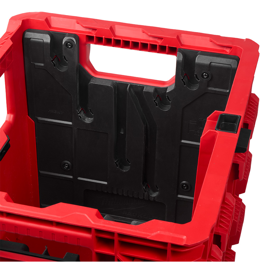 MILWAUKEE Wire Pulling Insert installed inside the PACKOUT XL Crate, showing the conduit support slots and mounting screws