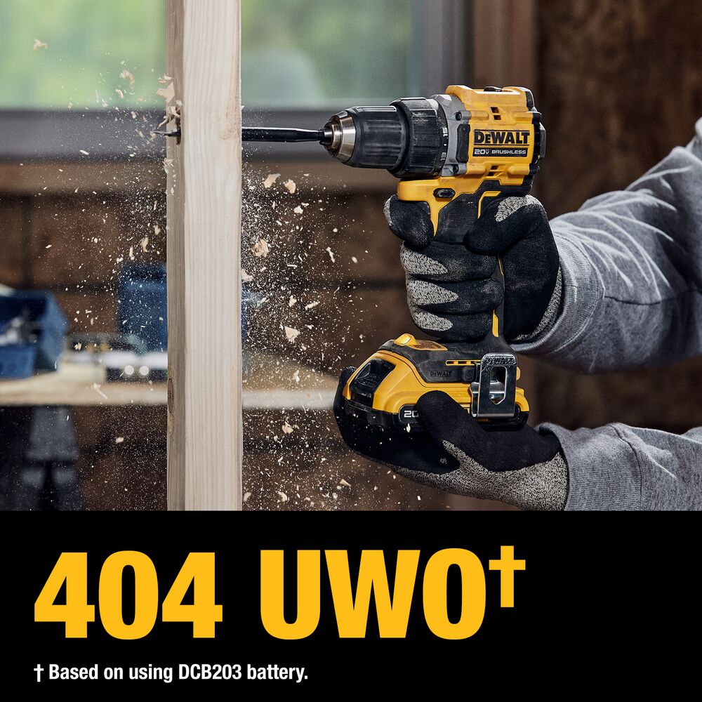 Worker drilling through wood with a DEWALT ATOMIC 20V MAX Brushless Drill/Driver delivering up to 404 UWO with a DCB203 battery